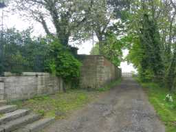 Oblique view of road leading past Tanfield Hall with bottom of steps visible May 2016